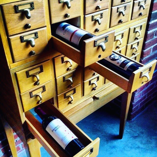 Card Cataglog Repurposed to Store Wine Bottles. Photo by Instagram user @salvagecrew