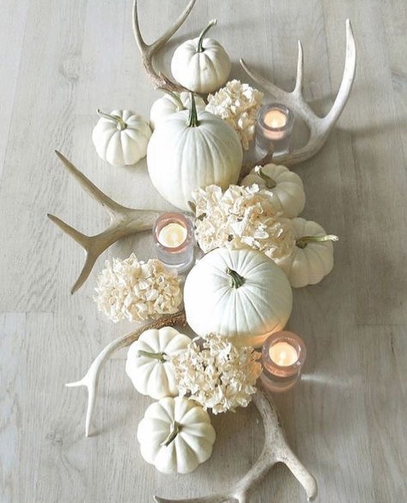 Homemade Dinner Table Decor Made From Pumpkins, Candles, and Animal Horns. Photo by Instagram user @woodsidehomescentralcal