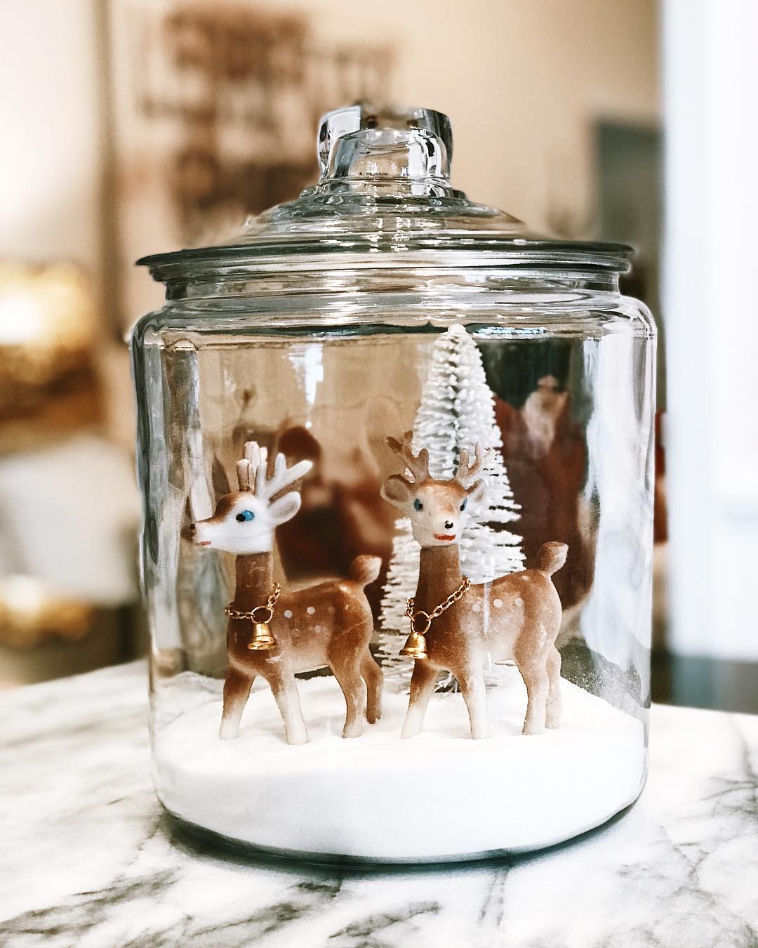 Homemade Snow Globe Made out of a Glass Jar with Toy Deer Inside. Photo by Instagram user @farmhousepeachco