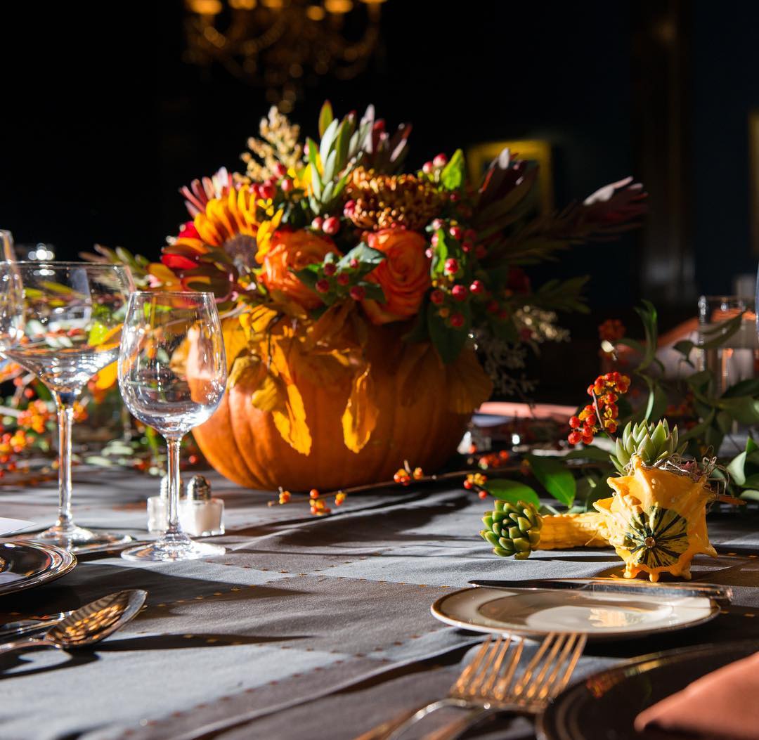 Dinner Table with Decorative Pumpkin in the Middle. Photo by Instagram user @ulcchicago