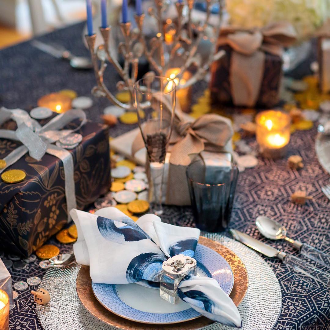 Table Set with Elaborate Utinsels for Hanukkah Dinner. Photo by Instagram user @kimseybert