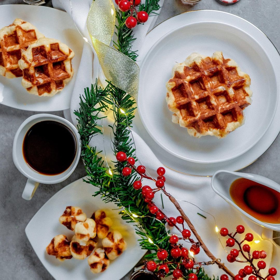 Mini Belgian Waffles on White Plates with Holiday Decorations on the Table. Photo by Instagram user @liegemanila
