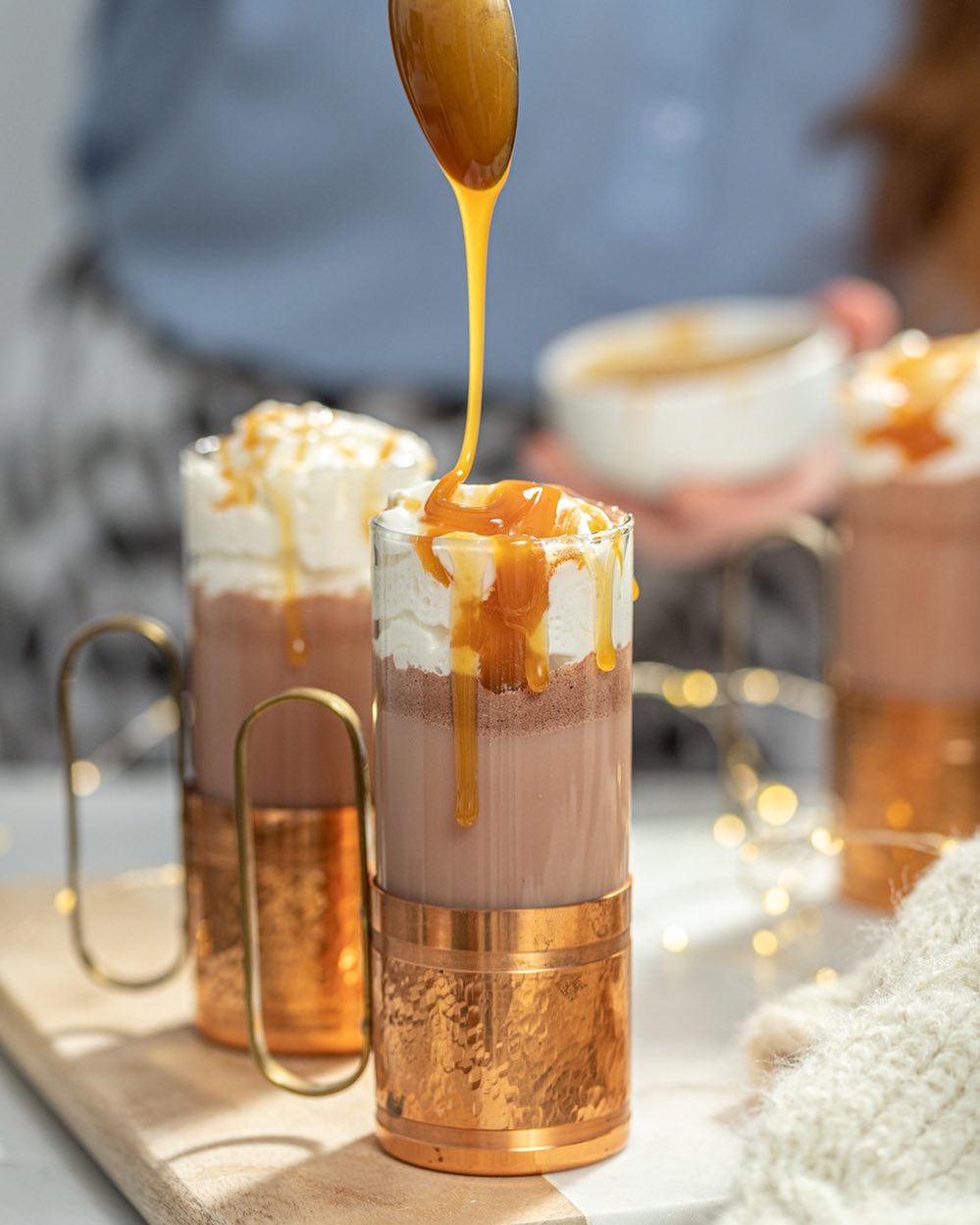 Caramel Hot Chocolate Drink with Caramel Drizzling Over Top. Photo by Instagram user @the.boozy.ginger