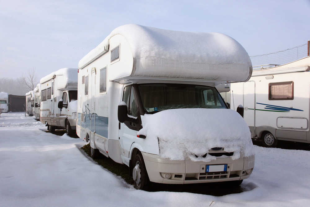 RV in Winter with snow piled on top.