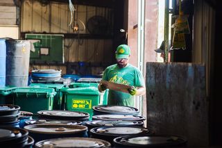 An employee working in a sustainable warehouse in Austin. Photo by Instagram user @breakitdownatx