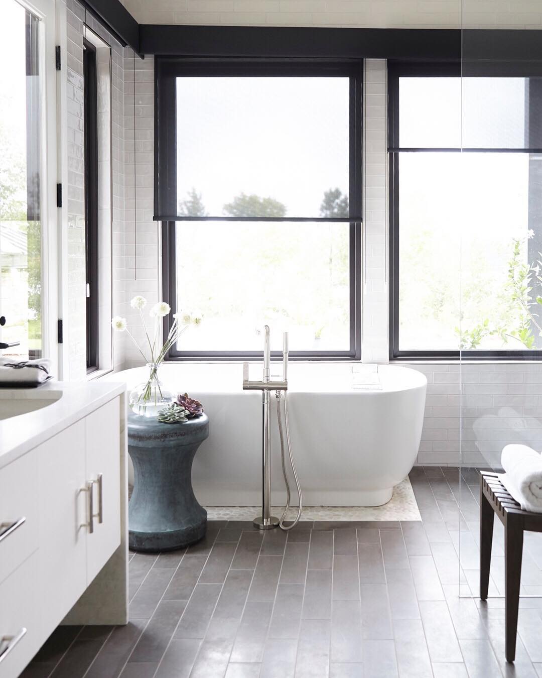 Neutral bathroom with gray tile. Photo by Instagram user @barbourspangle