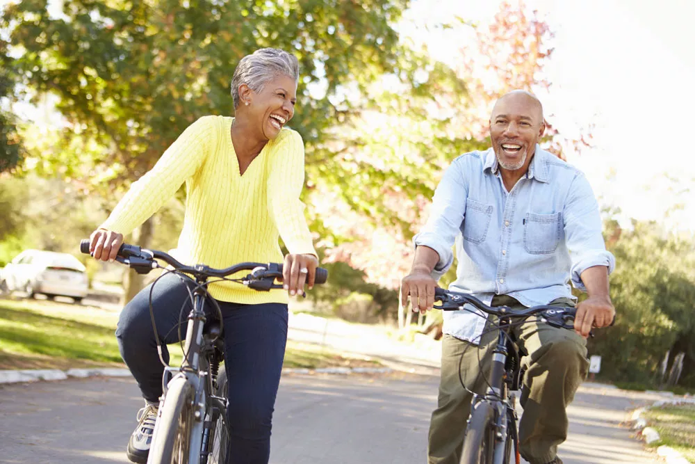Retired couple riding bikes