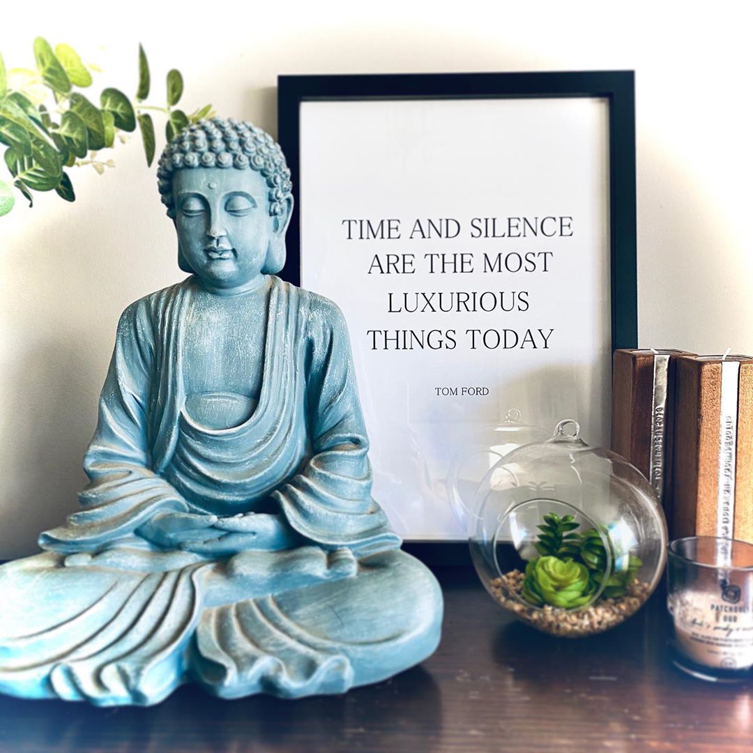 Buddha statue, framed print, and succulent. Photo by Instagram user @foreverhouseandhome 