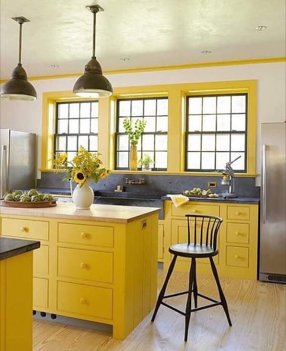 Kitchen with yellow cabinets and window trim. Photo by Instagram user @homenhance