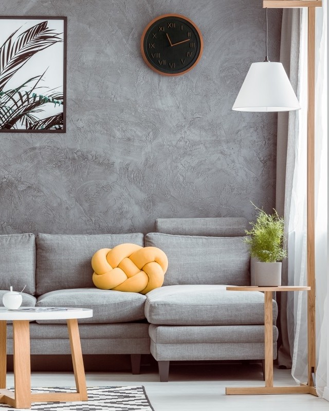 Living room design with clock over couch. Photo by Instagram user @rawdicalclocks