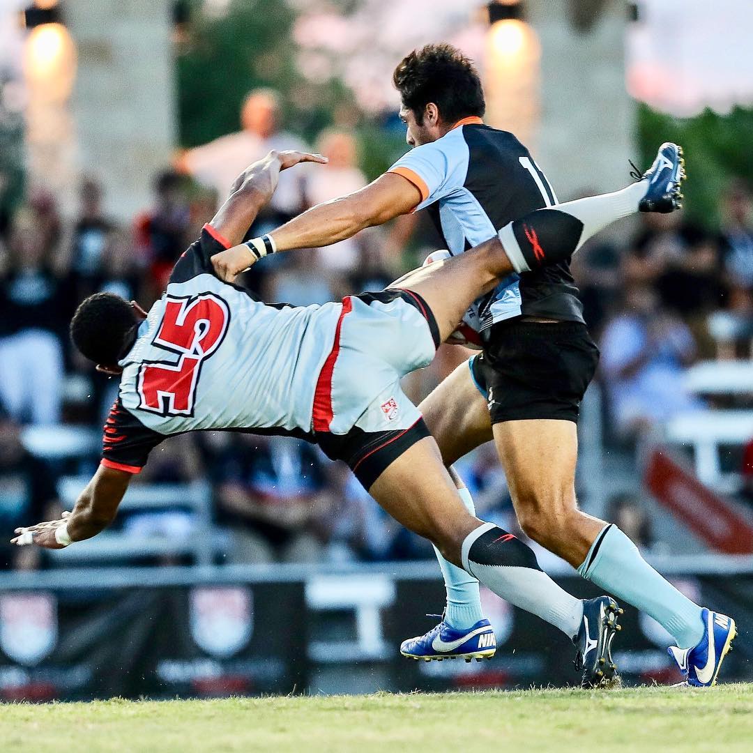 Member of Austin Gilgronis Rugby Team pushes down defender. Photo by Instagram user @gilgronis