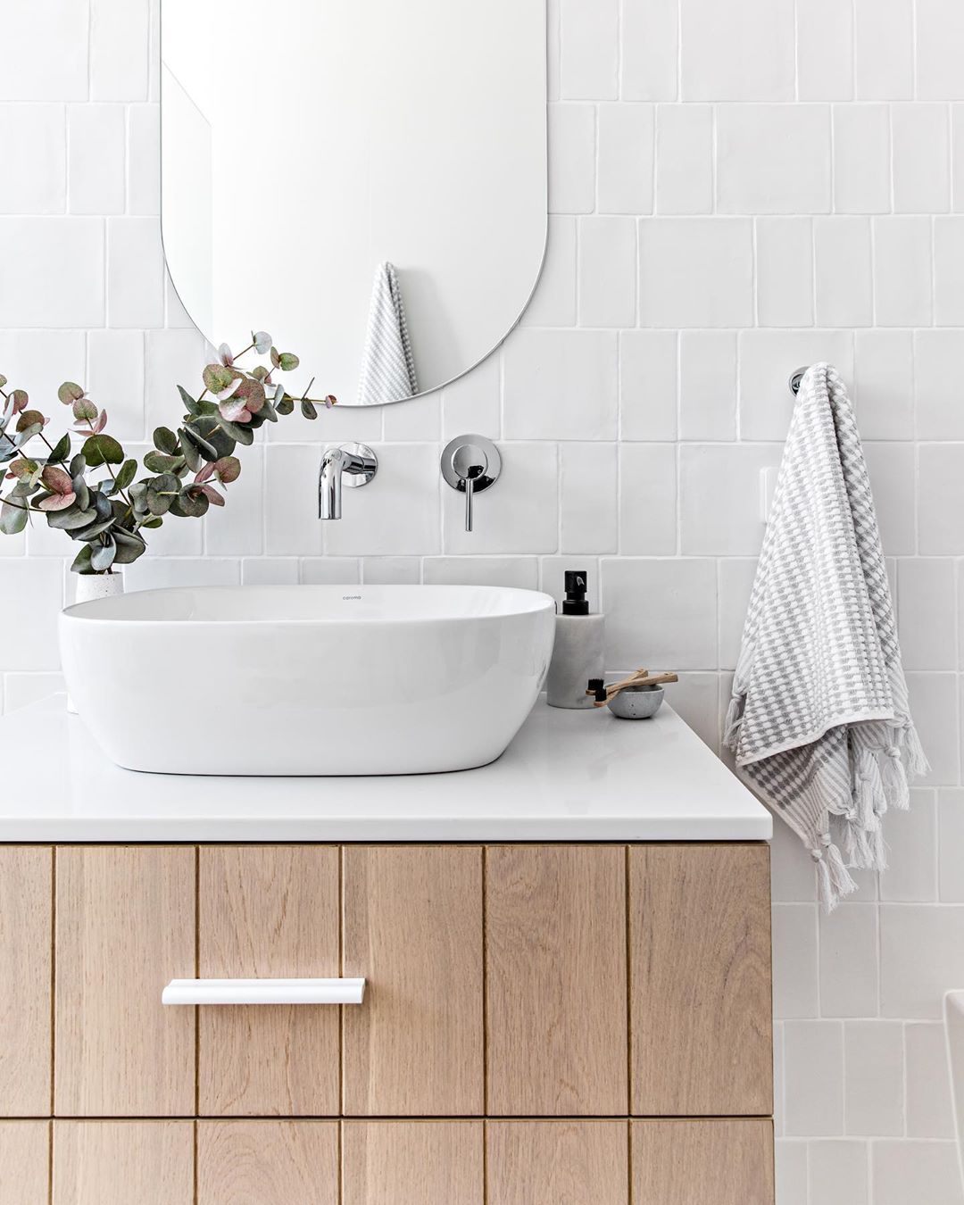 Minimalist bathroom wood vanity. Photo by Instagram user @the_stables_