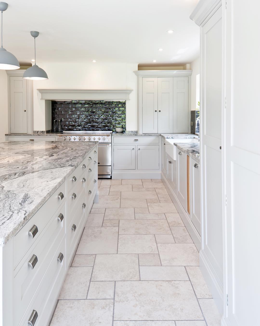 Kitchen with marble and tile. Photo by Instagram user @collinsbespoke