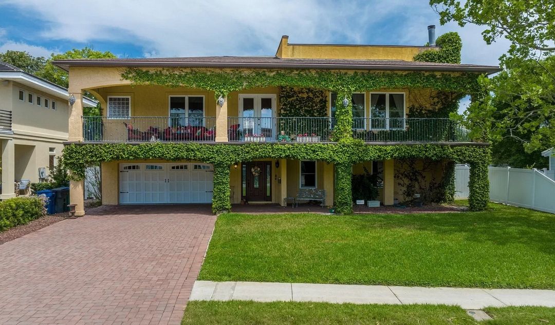 A two-story home covered in vines in Neptune Beach, Jacksonville. Photo by Instagram user @maryfaulds_realtor.