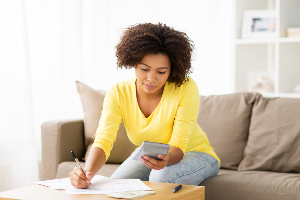 Women in yellow saving money