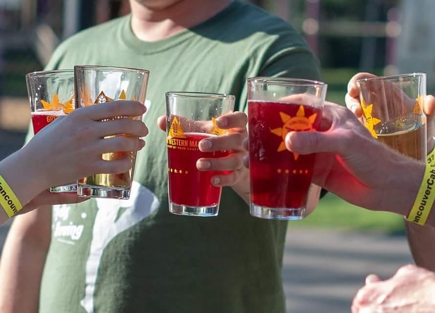 Five glasses of beer and a person in a green shirt at the Vancouver Beerfest. Photo by Instagram user @vancouverbrewfest.