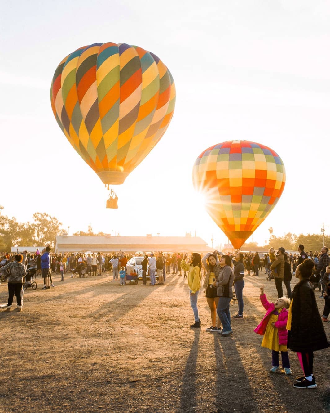 Two hot air balloons taking off in Clovis, CA. Photo by Instagram user @s.ligonde