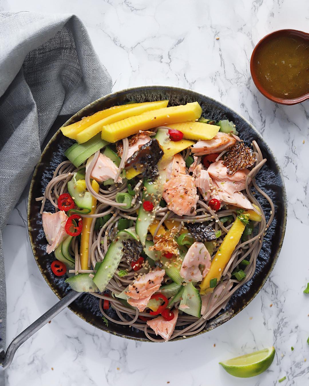 Bowl of Soba Noodle Salad with Salmon. Photo by Instagram user @everylittlecrumb