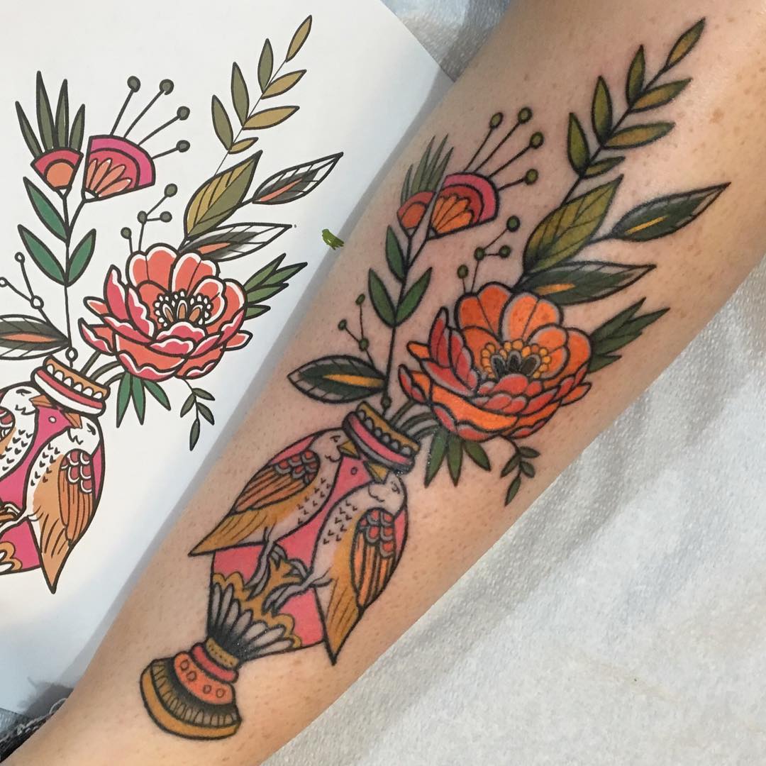 Arm with a Colorful Tattoo of Birds and Flowers. Photo by Instagram user @emilierobinsontattoo