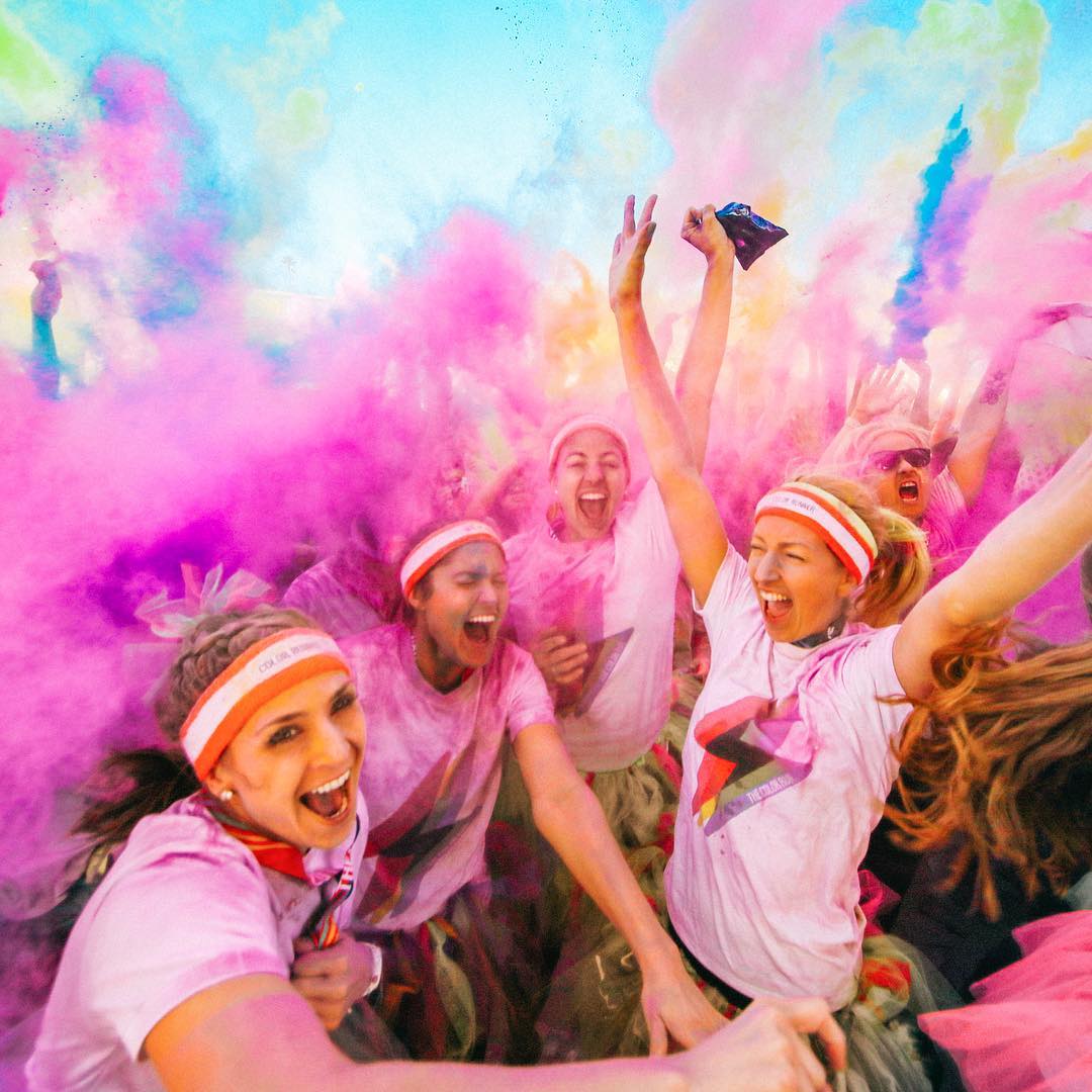 Women Excitedly Screaming Amid a Cloud of Paint During the Color Run. Photo by Instagram user @thecolorrun