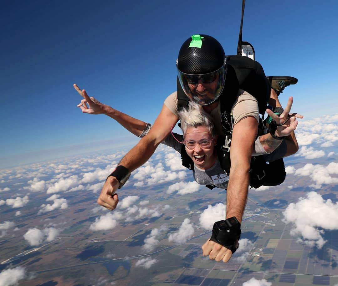 Woman SkyDiving with an Instructor. Photo by Instagram user @lulutattooart