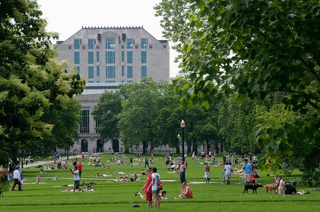 College students hanging out on the green space of OSU campus. Photo by Instagram user @ theohiostateuniversity.