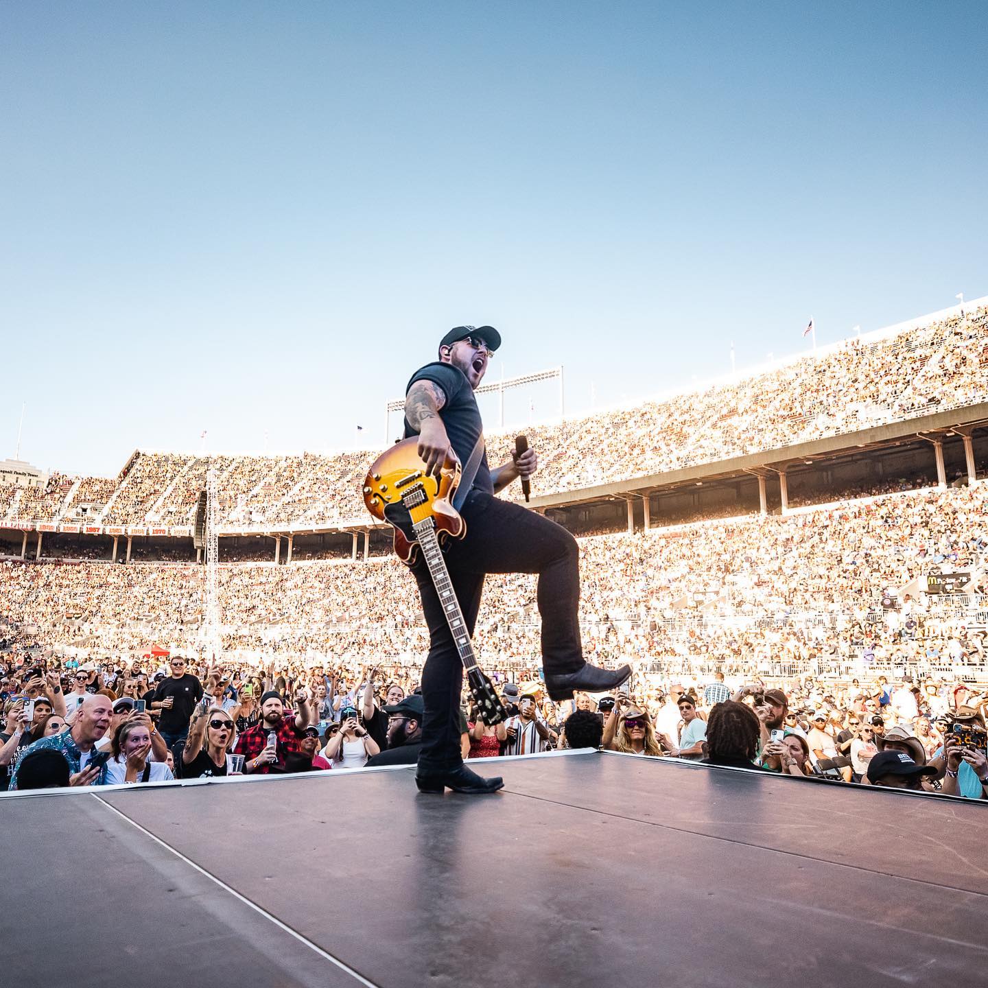Country musician Kameron Marlowe performing in front of a packed stadium at the Buckeye Country Superfest. Photo by Instagram user @buckeyecountrysuperfest