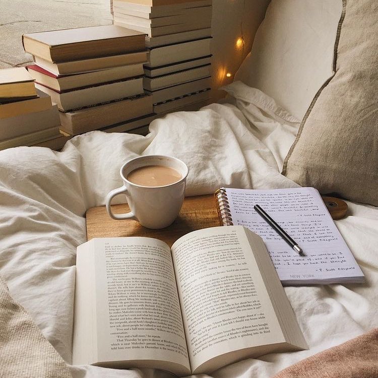 Open Book, Journal, and Cup of Coffee on a Bed. Photo by Instagram user @well_together