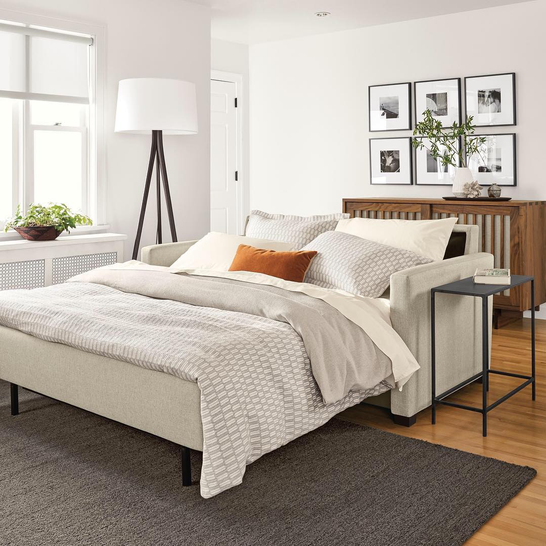 Cozy Guest Bedroom with Bed, Lamp, and Nightstand. Photo by Instagram user @roomandboard