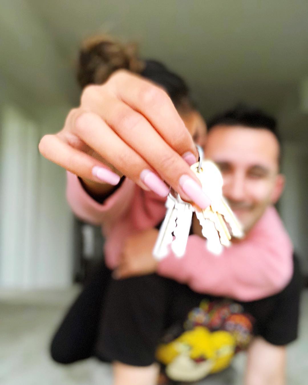 Couple Moving in Together Holding a Set of Keys. Photo by Instagram user @katrinamalaiba