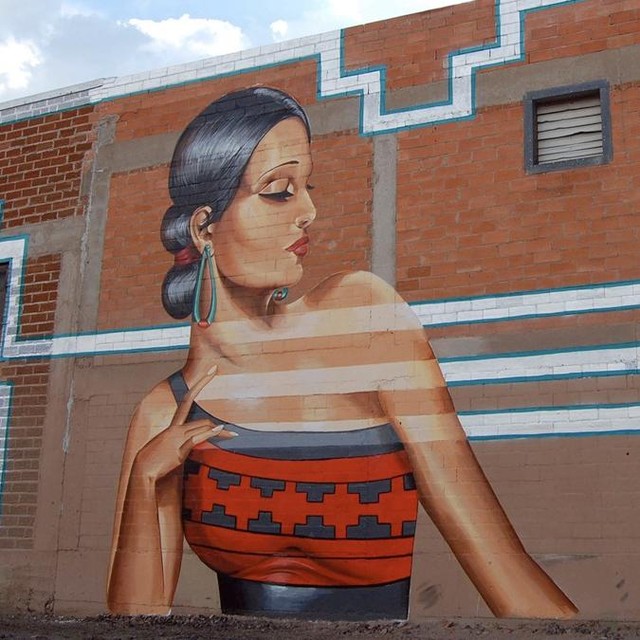 Mural of a woman created by artist Nani Chacon painted on the side of a building. Photo by Instagram user @visitabq