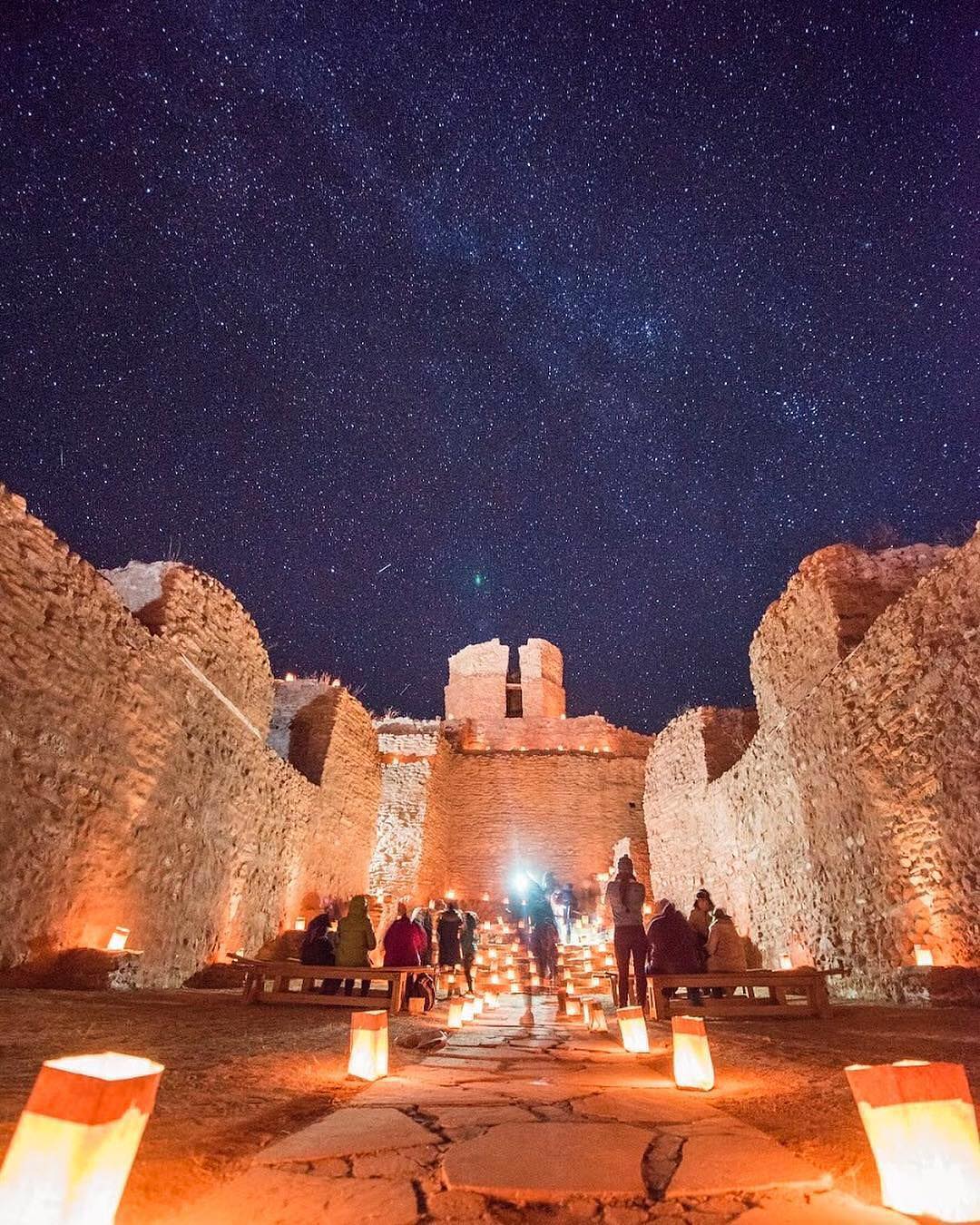 Visitors look at the clear night sky from inside the ruins of San José de los Mission Church. Photo by Instagram user @visitabq