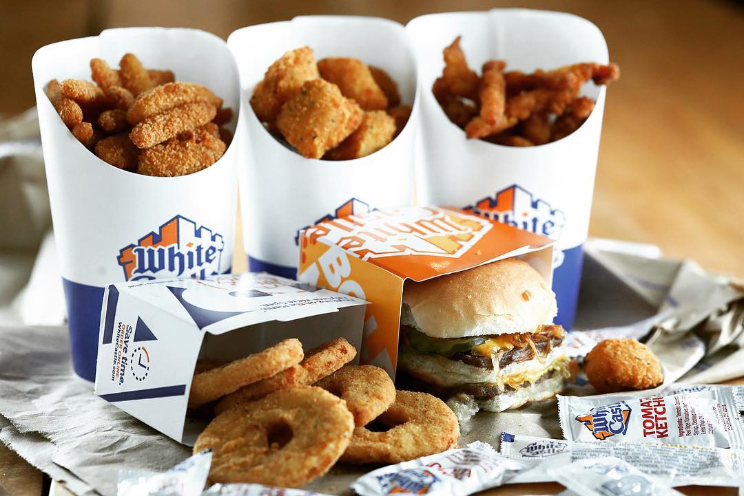 Closeup of sliders, chicken nuggets, and more in White Castle containers. Photo by Instagram user @whitecastle