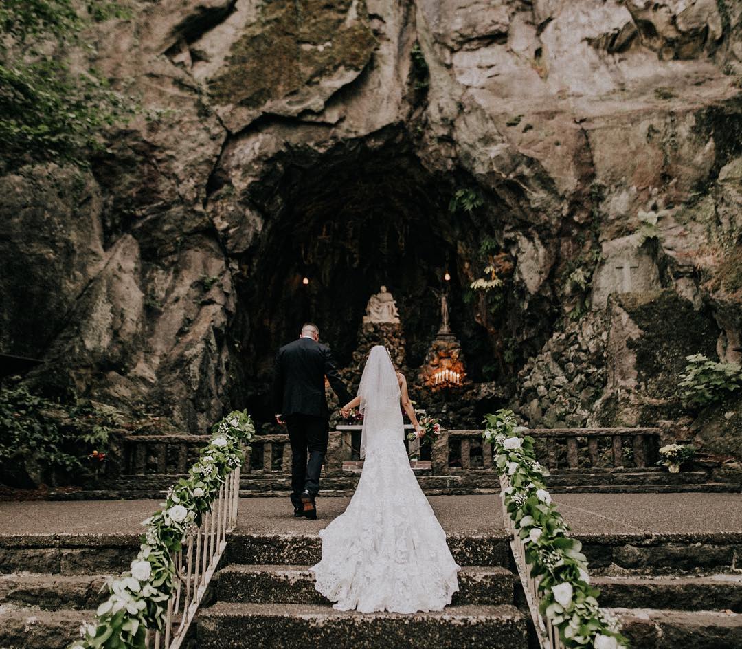 Couple Walking Down the Aisle at a Gorgeous Outdoor Wedding. Photo by Instagram user @christycassano