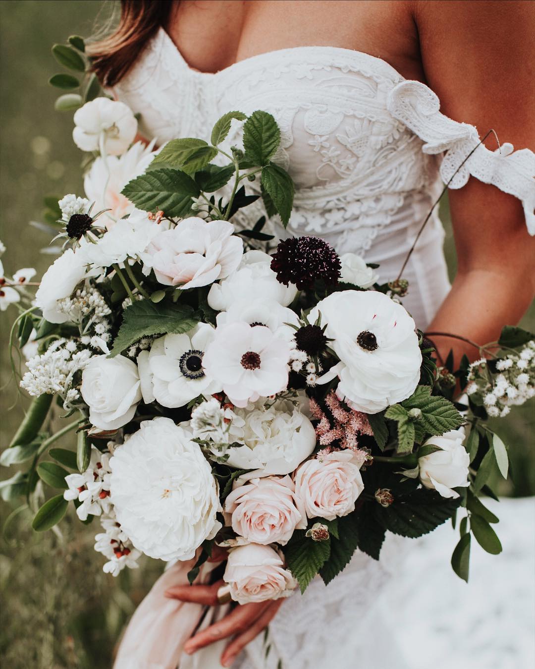 Bride Holding a Beautiful Boquet of Flowers on Wedding Day. Photo by Instagram user @thelittlealli