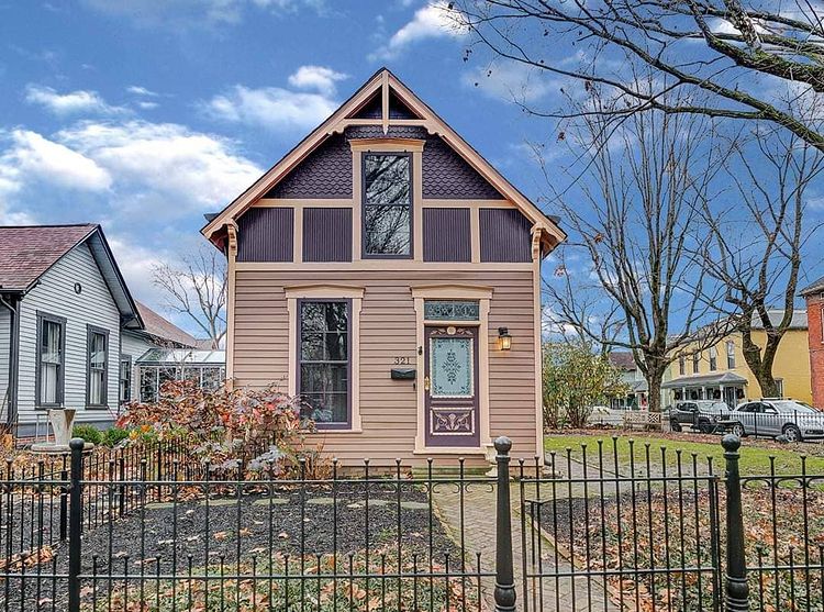 Brown Home with Dark Rooftop and Black Gated Yard in Lockerbie Square Photo via @natalieclaytonindy