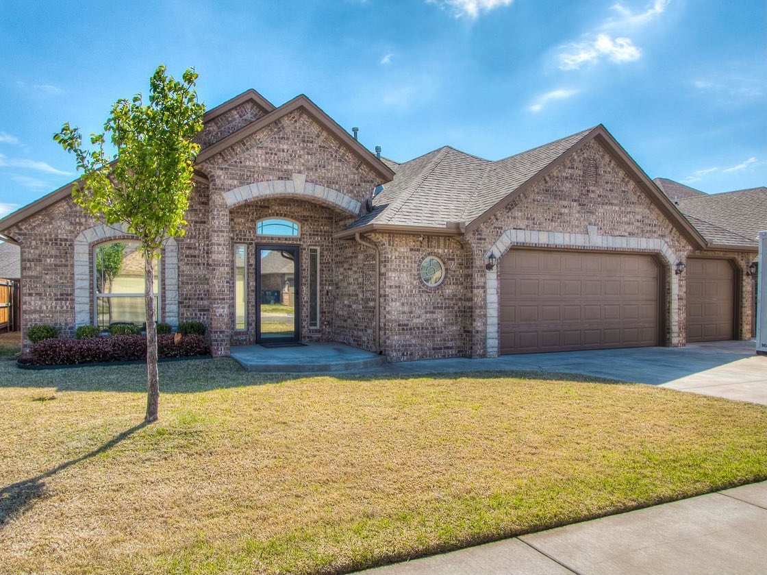 Pictured is a 3 bed 2 bath brick house in Yukon, Oklahoma. Picture by Instagram username @abide_realty_group