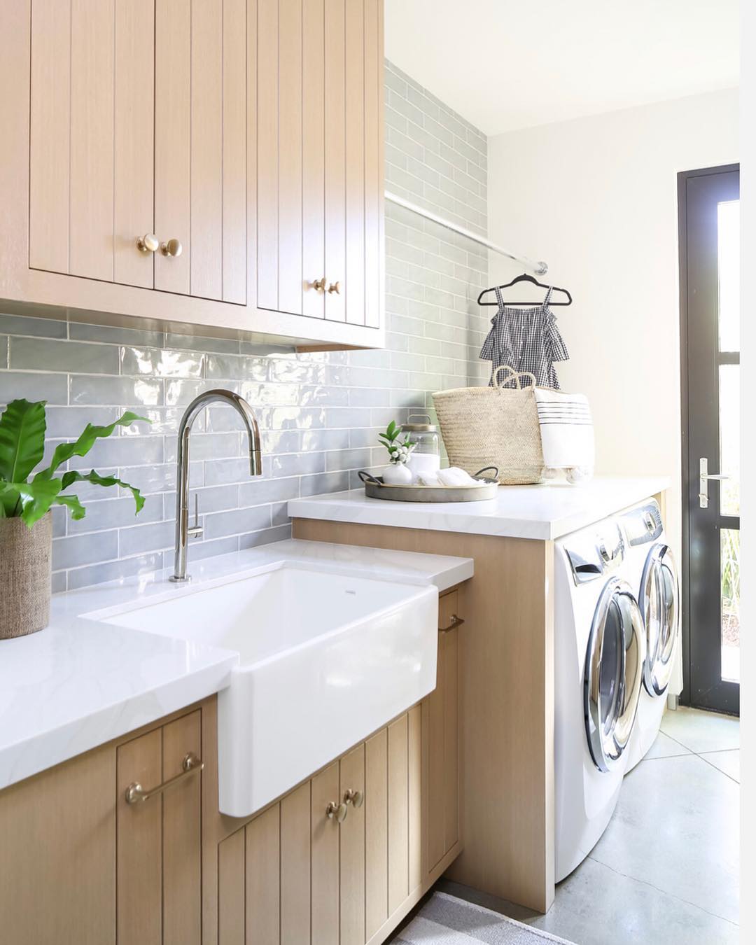 Farmhouse laundry room. Photo by Instagram user @brookewagnerdesign