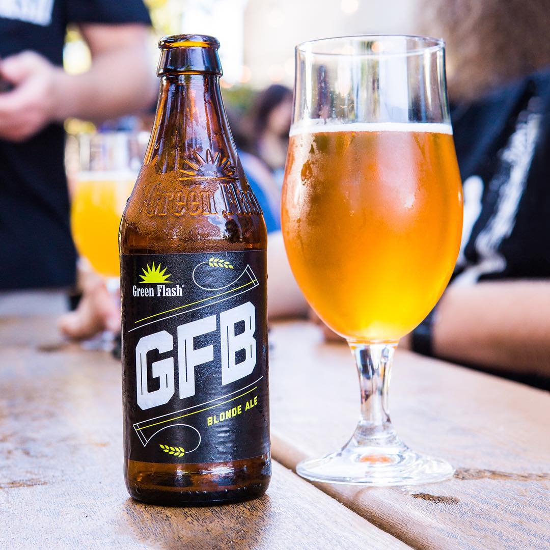 Glass of beer and empty beer bottle. Photo by Instagram user @greenflashbeer