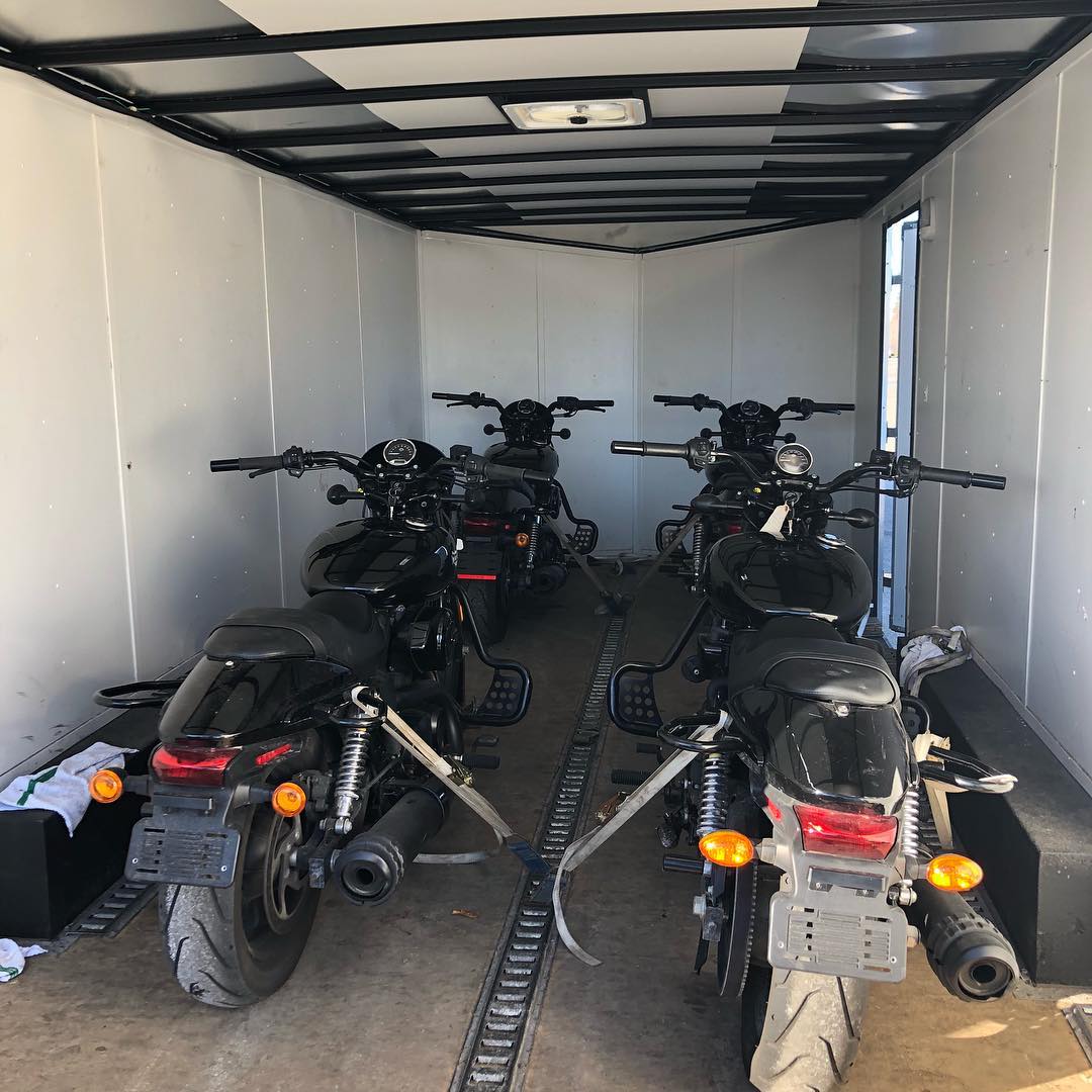 four motorcycles being stored inside of an enclosed trailer photo by Instagram user @humbermotorcycle