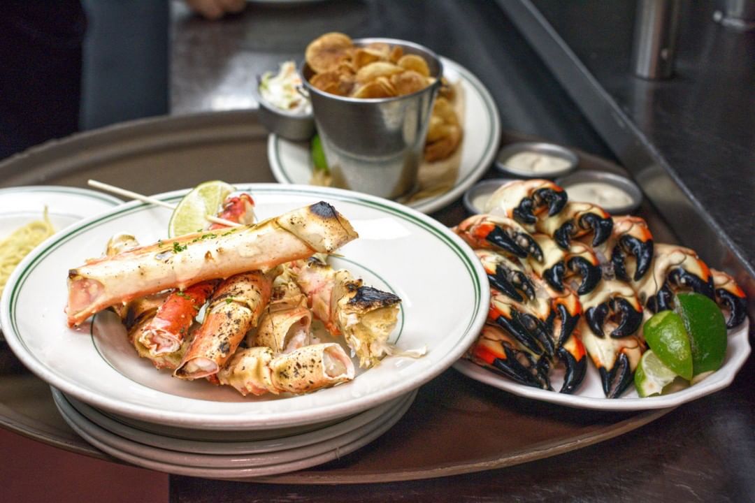 Plate of crab and stone crab claws at Jones Stone Crab in Miami, FL. Photo by Instagram user @joesstonecrab