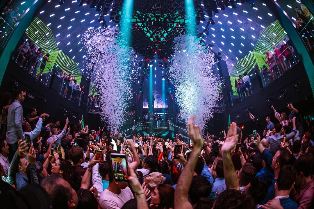 People dancing in a nightclub with confetti at LIV in Miami, FL. Photo by Instagram user @livmiami