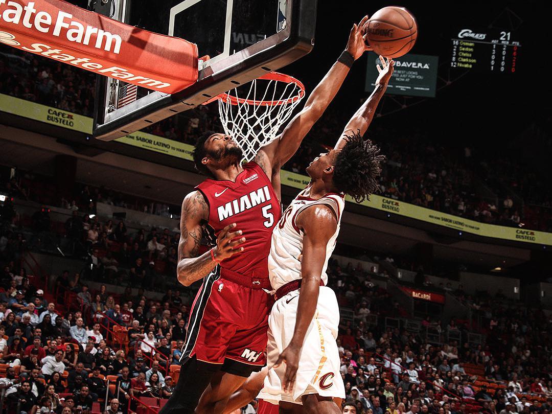 Two basketball players jumping for the ball at AmericanAirlines Arena in Miami FL. Photo by Instagram user @miamiheat