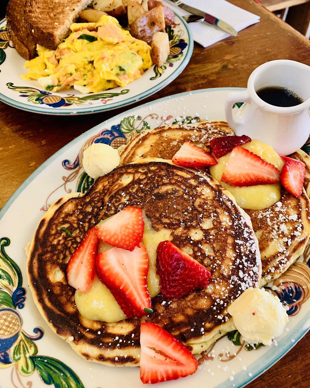 Plate of pancakes with strawberries from Zazie. Photo by Instagram user @eatinwithcorinna