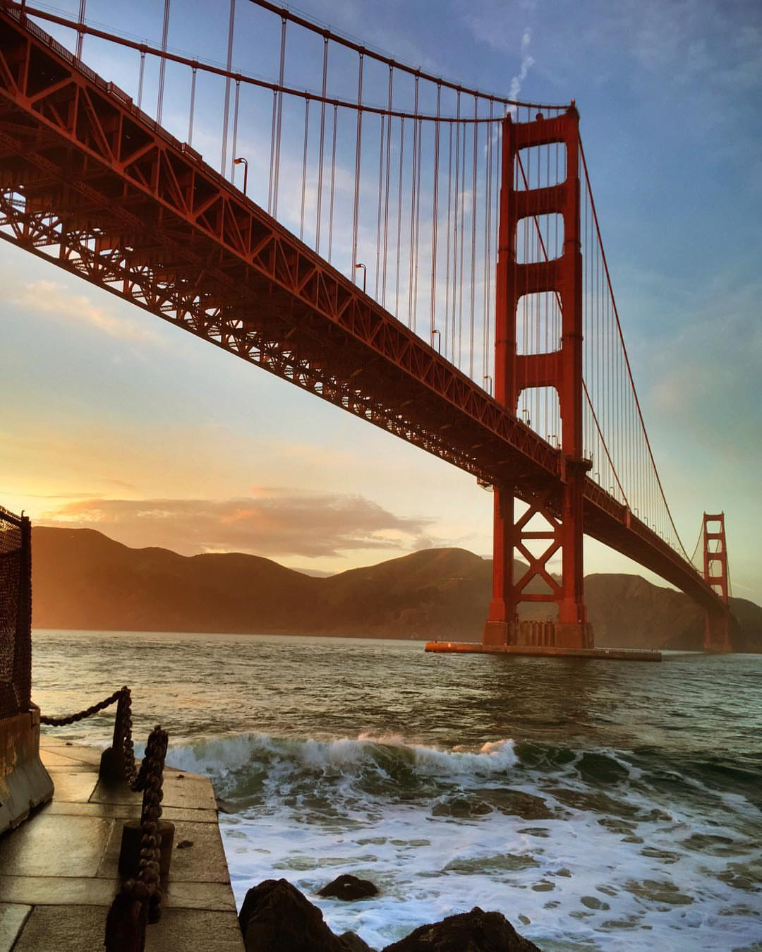 The red Golden Gate Bridge at sunset. Photo by Instagram user @ludditeking