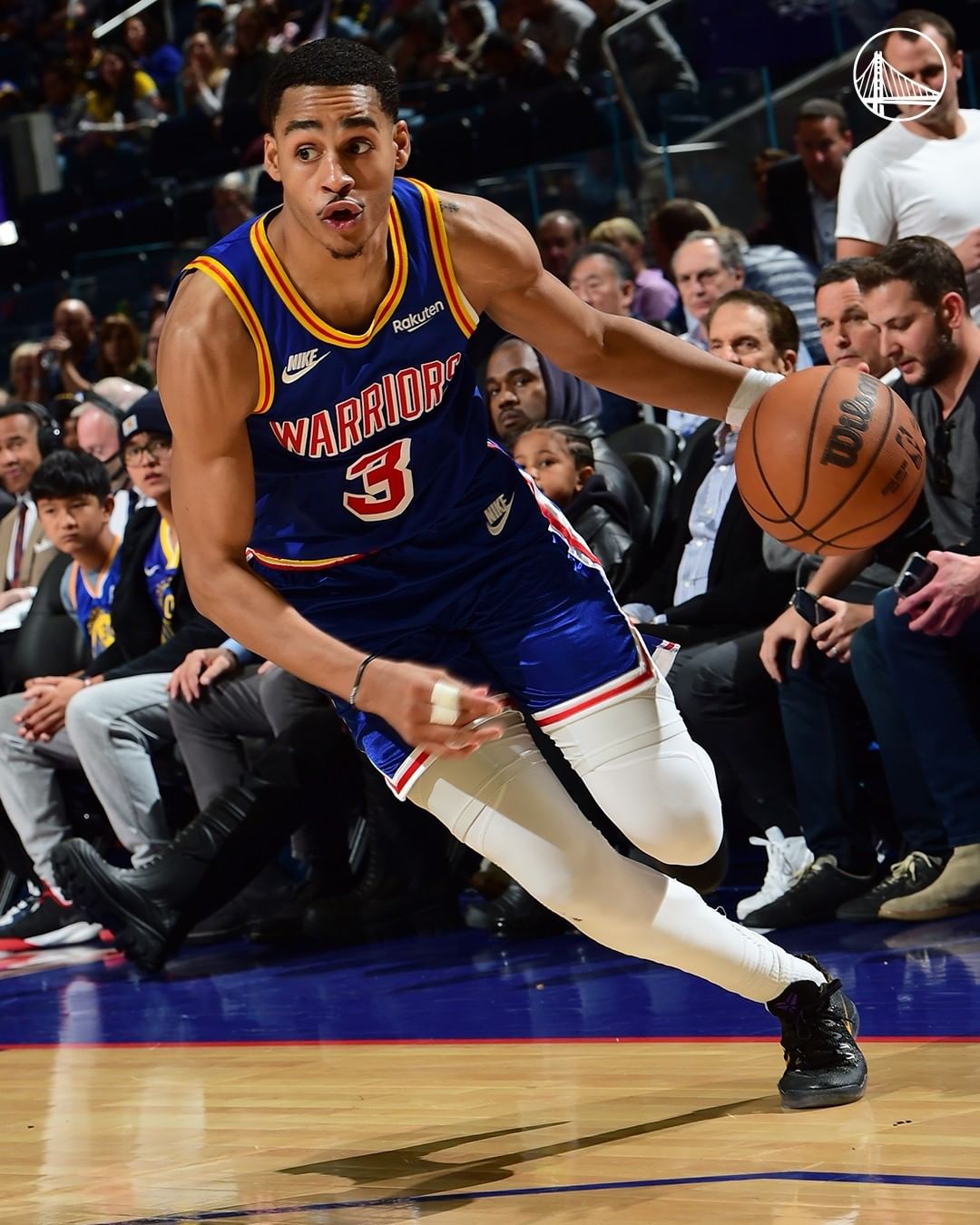 Basketball player in the Golden State Warriors dribbling the ball down the court. Photo by Instagram user @warriors