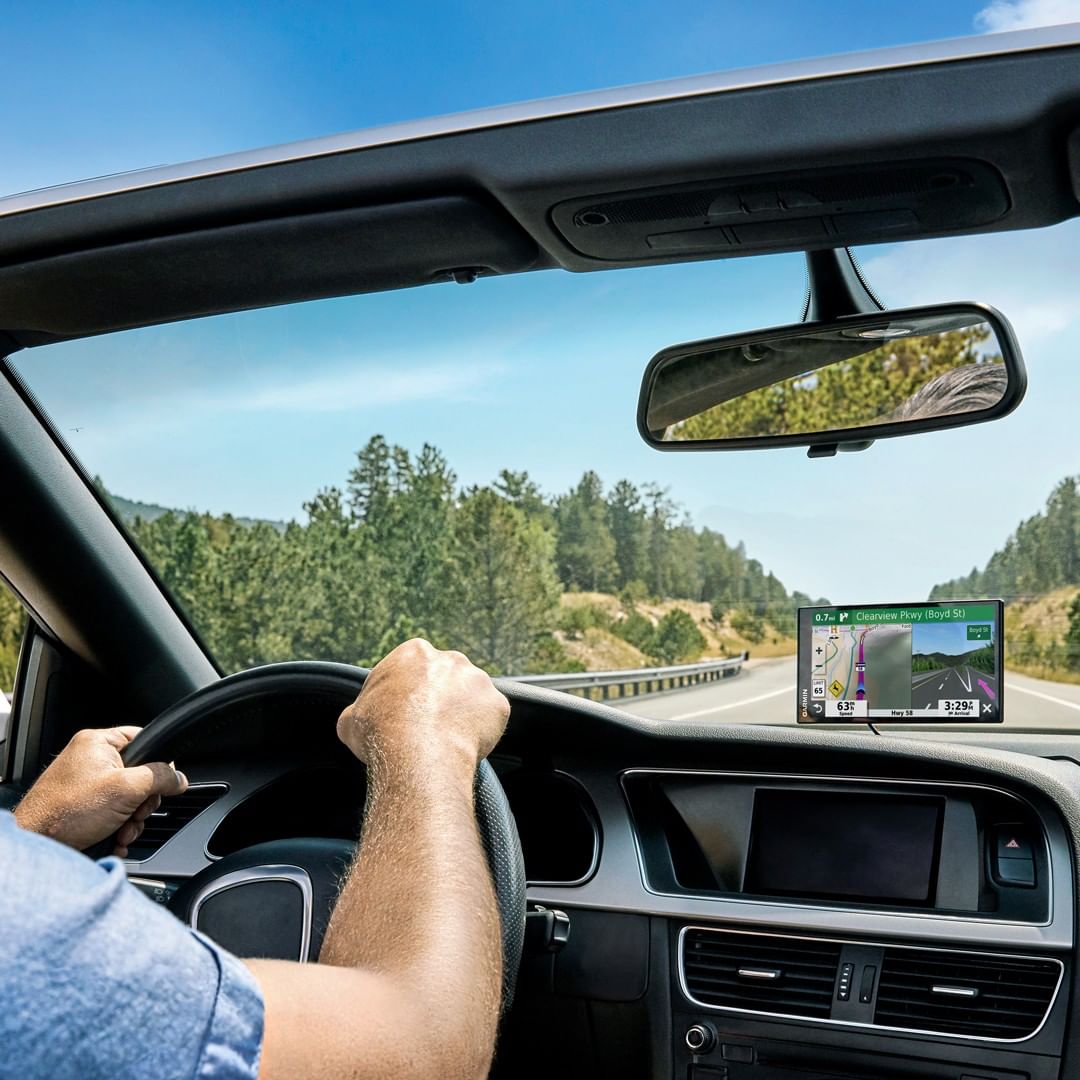 Man driving on the road looking at his gps. Photo by Instagram user @garmin