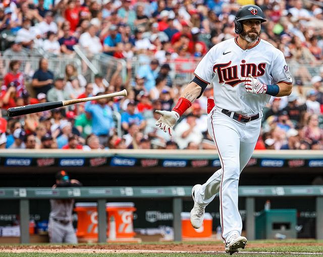 Minnesota Twins baseball player runs and throws bat after hitting a homerun. Photo by Instagram user @twins.