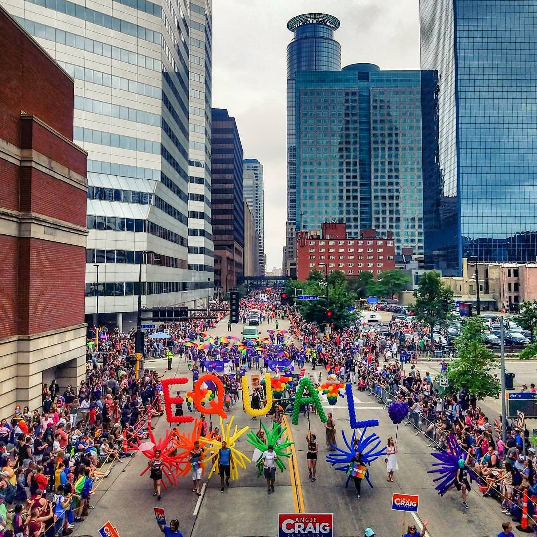 Crowd celebrates Twin Cities Pride parade in downtown Minneapolis. Photo by Instagram user @marktimemedia.