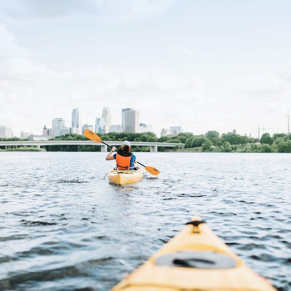 People kayaking in a Minneapolis lake. Photo by Instagram user @mspmag.